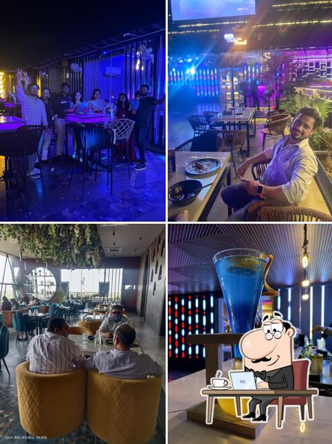 Take a seat at one of the tables at The Trunk Rooftop fine dine Restaurant Mathura Best Cafe in Mathura Best bar in Mathura