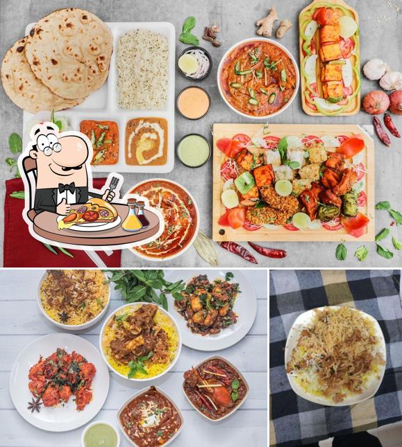 Get pizza at The Cuisine of Hyderabad