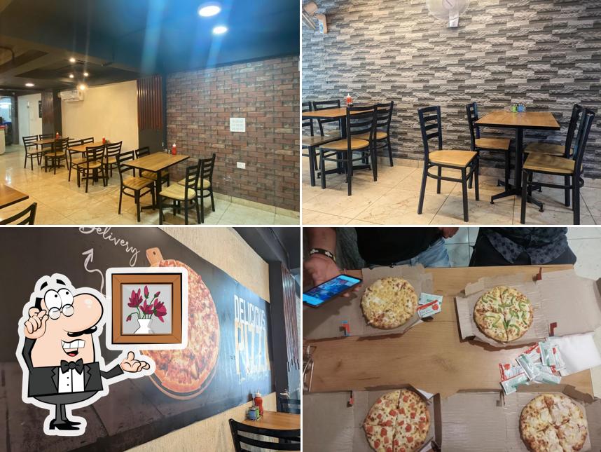 Take a seat at one of the tables at Pepper’s Pizza Indirapuram ( Gyan khand -1 )