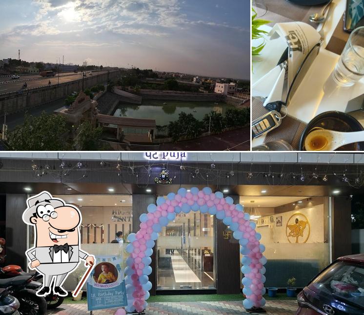 The picture of Pet Puja - a Pure Vegetarian Restaurant’s exterior and beverage