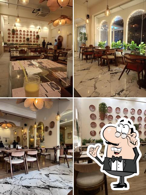 Take a seat at one of the tables at Raja Bhojanam- An Authentic Telugu Restaurant