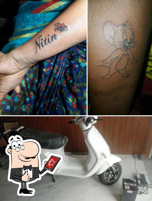 Here's a pic of Tom And Jerry tattoo studio
