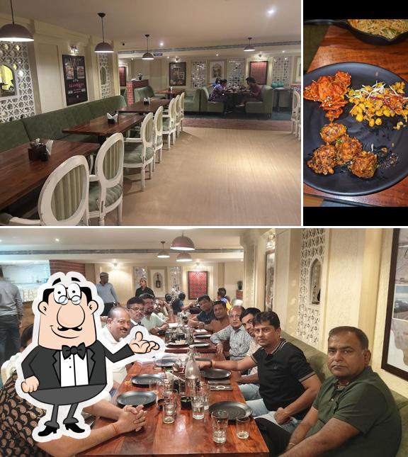 Take a seat at one of the tables at Namchi - Pure Veg Restaurant (Banjara Hills)