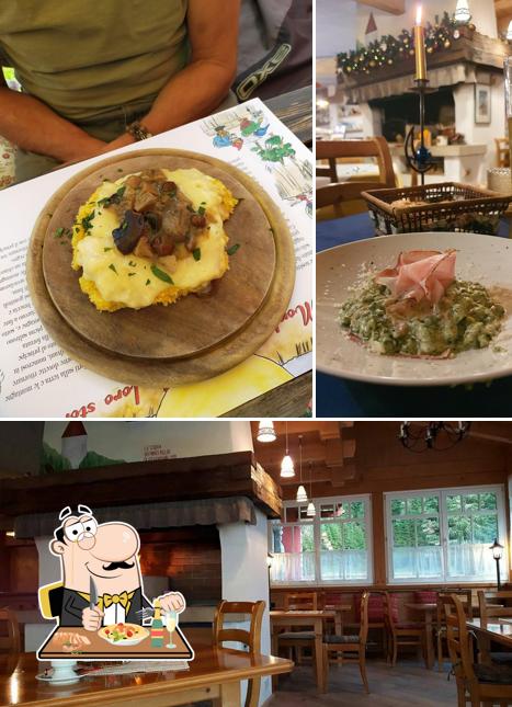 Questa è la foto che mostra la cibo e interni di Rifugio Monti Pallidi