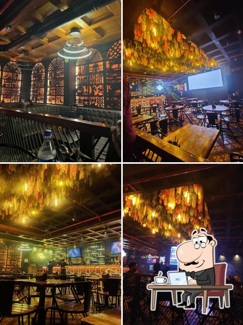 Take a seat at one of the tables at The Orange Mint Lounge - Bandra