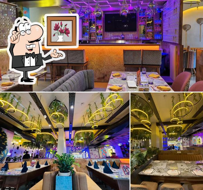 Take a seat at one of the tables at The Land Of Grill
