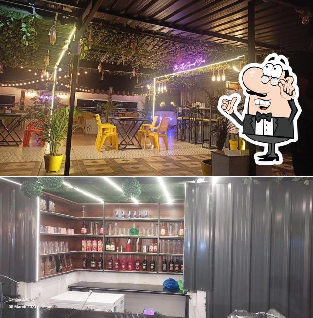 Take a seat at one of the tables at THE SKY SQUAD CAFE AND LOUNGE