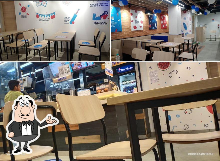 Take a seat at one of the tables at Domino's Pizza Murgasole, Asansol