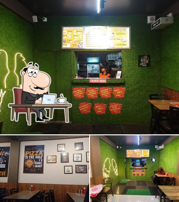 Take a seat at one of the tables at Mountain'S PIZZA Club, Sanjauli