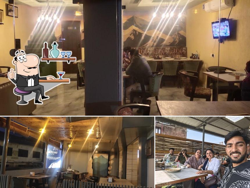 Take a seat at one of the tables at Khatirdari Restaurant Baijnath (Pure Vegetarian)