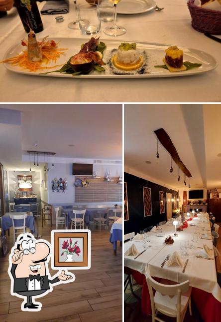 La foto della interni e bevanda di Taverna Brudi