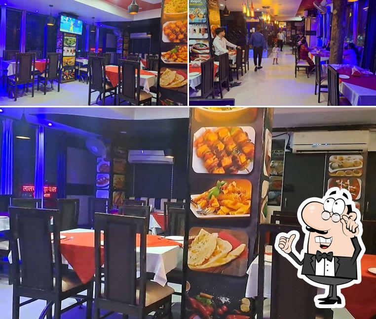 Take a seat at one of the tables at Vinayak Restaurant