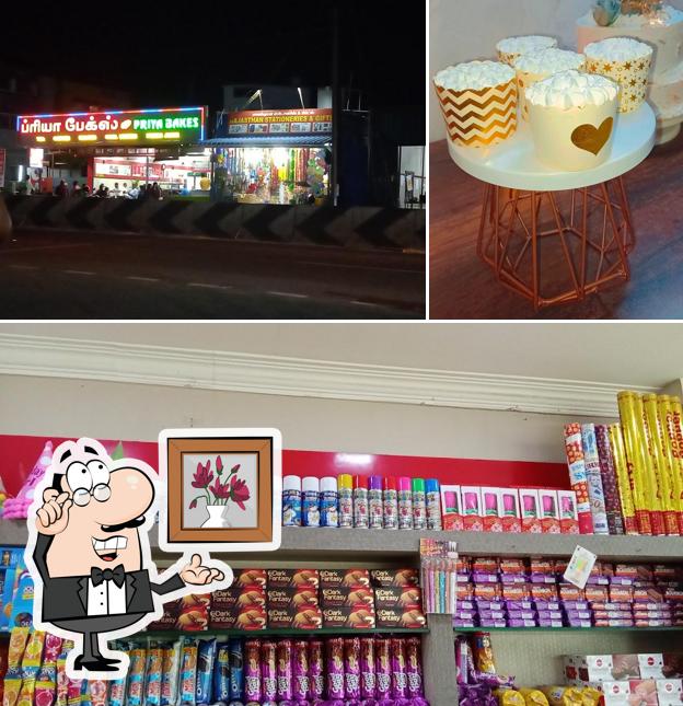 Check out the photo depicting interior and food at PRIYA BAKES