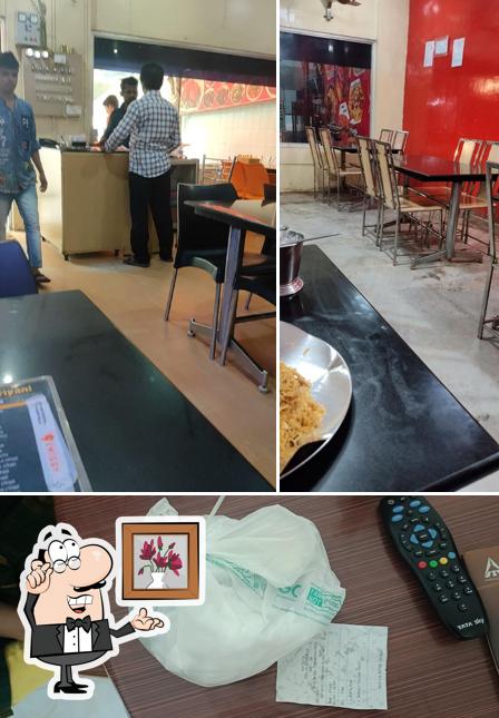 Among various things one can find interior and food at Hyderabad Biryani