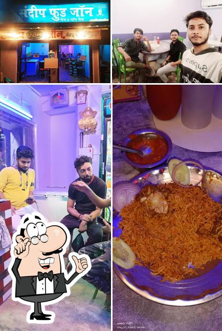 This is the photo displaying interior and food at Sandeep Food Zone