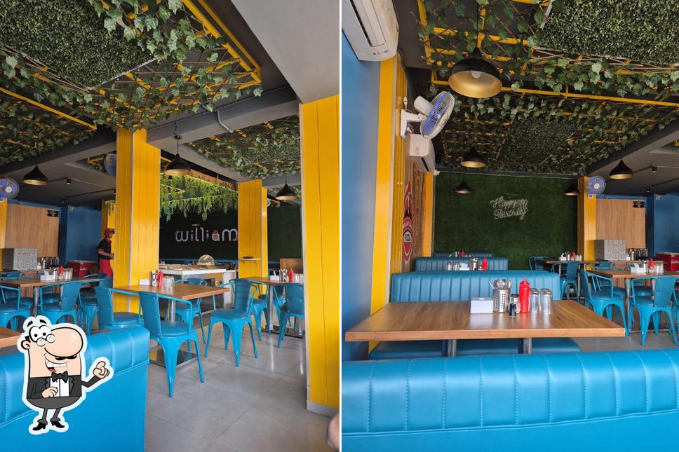 The interior of William John's Pizza Shahibaug