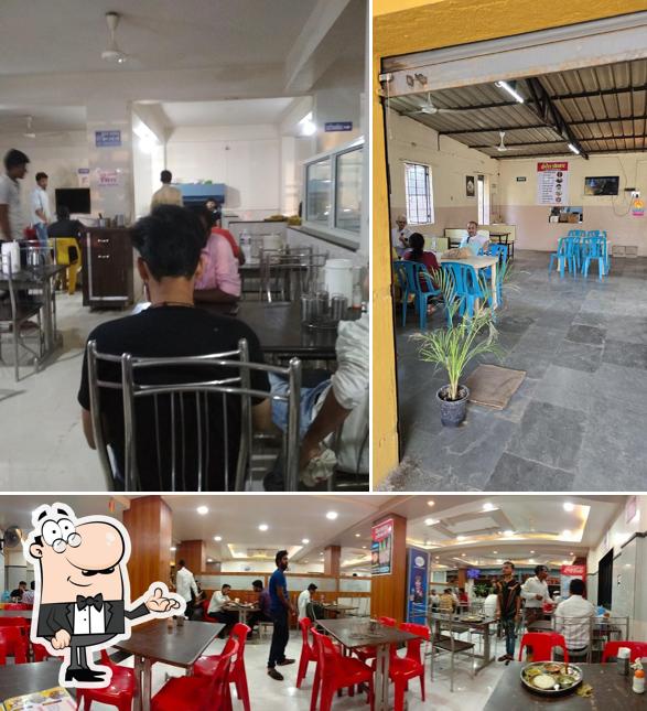 Take a seat at one of the tables at Hotel Shrinath (Bhigwan Famous Fish)