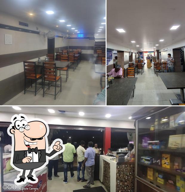 Take a seat at one of the tables at Anandh Vegetarian A/C