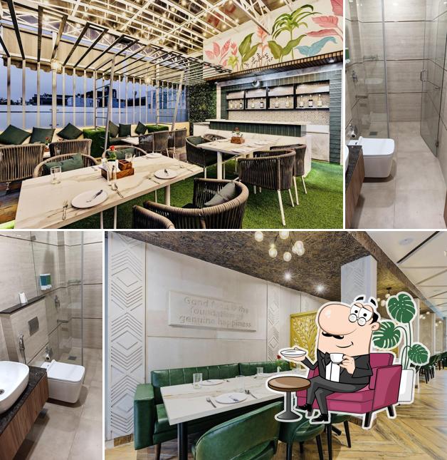 Take a seat at one of the tables at Hotel Emerald
