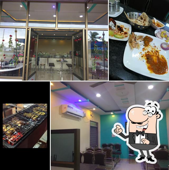 Take a seat at one of the tables at Hotel New Food Court