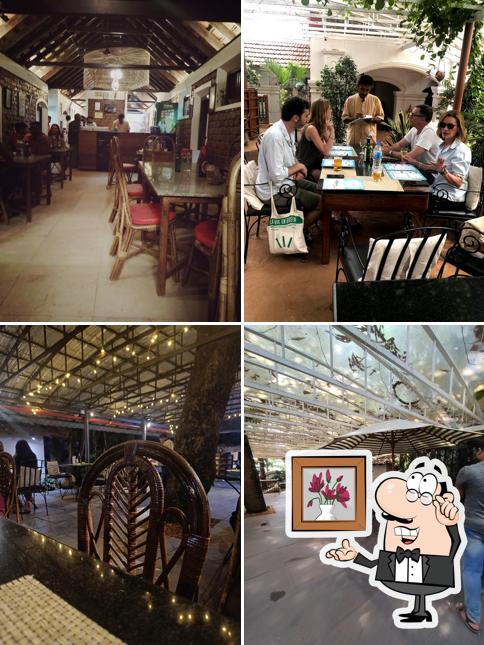 Take a seat at one of the tables at THE HARBOUR Bar & Beer Parlour, Alappuzha