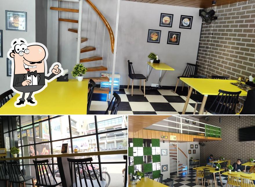 Take a seat at one of the tables at Cafe 8154