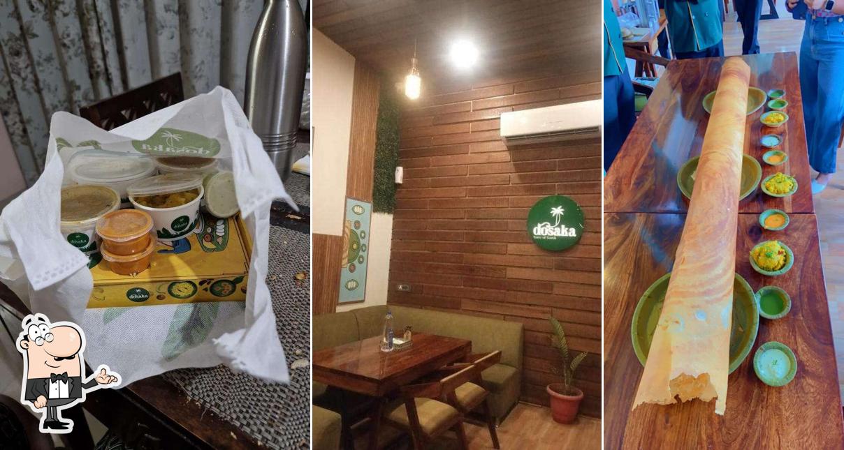 Take a seat at one of the tables at Dosaka - Taste Of South