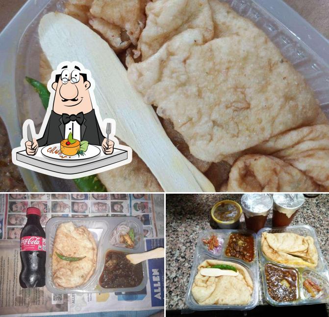 Take a look at the picture depicting food and beer at Radhey Shyam Chole Bhature