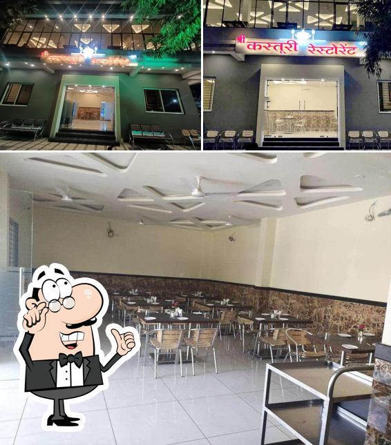 Take a seat at one of the tables at Shree Kastoori Restaurant