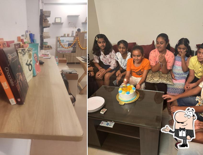 Take a seat at one of the tables at The Bakersway- Bakery & Cake Shop Customized Cakes Cake, Pastries, Burger In Greater Noida