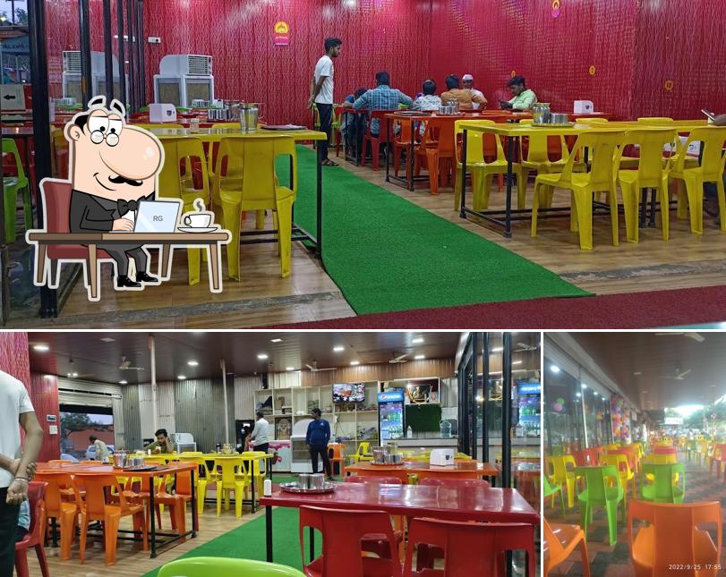 Take a seat at one of the tables at Hotel kamat shreyash pure veg restaurant