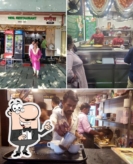 Take a seat at one of the tables at Mani's Cafe