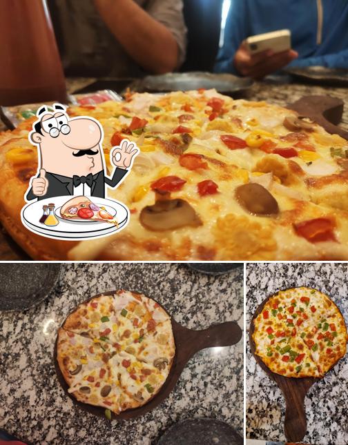 Try out pizza at Cloudy Food Restaurant & Cafe