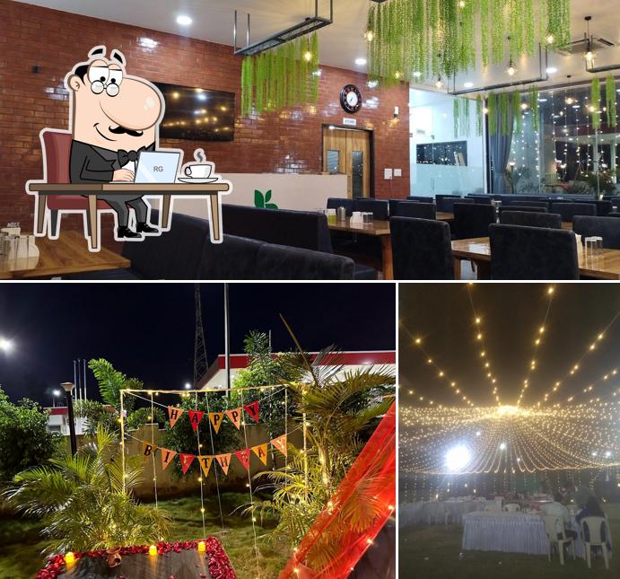 Take a seat at one of the tables at Kalpvant Multicuisine Restaurant & Party Plot