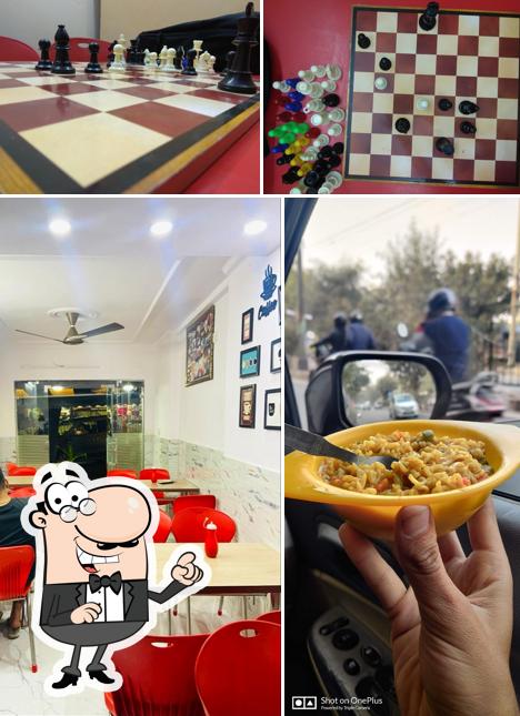 Take a seat at one of the tables at Onkar Cafe