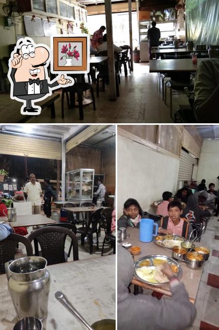 Among various things one can find interior and dining table at Swami Samarth Bhojnalay