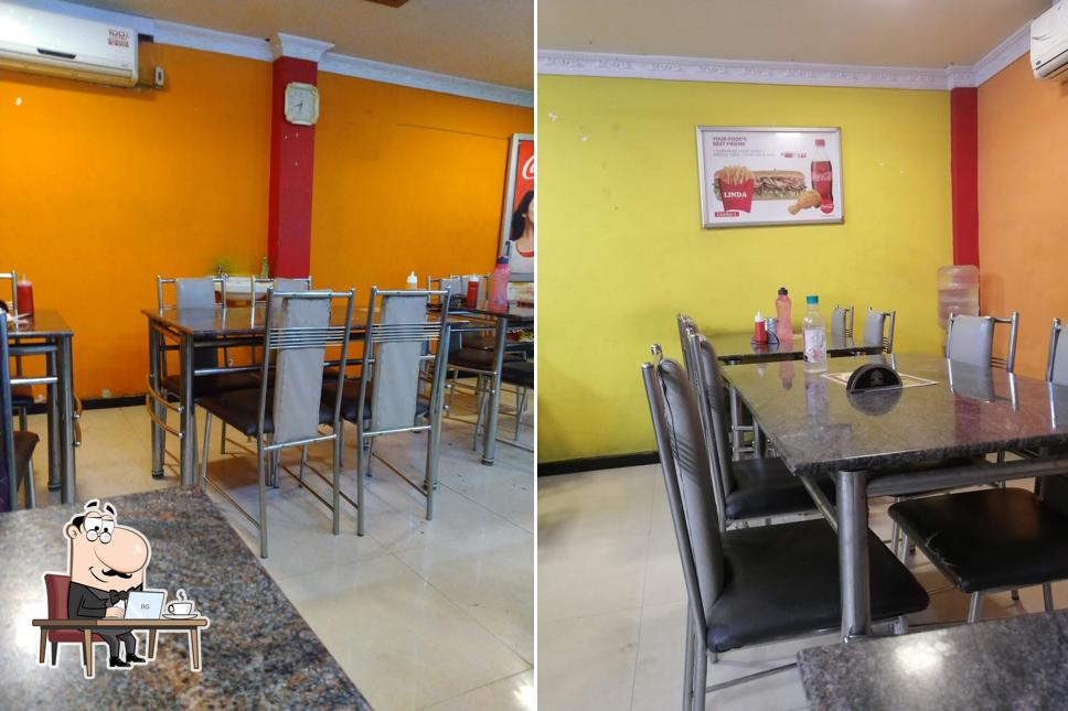 Take a seat at one of the tables at Linda Restaurant