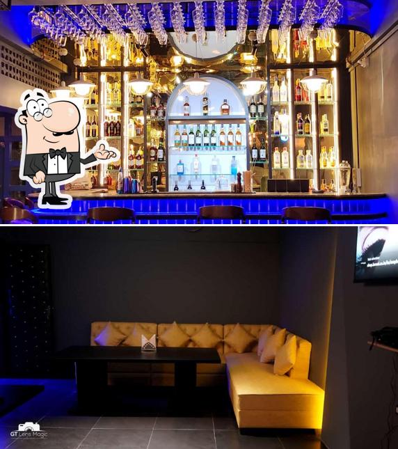 Take a seat at one of the tables at CENTURY Lounge Bar & Restro