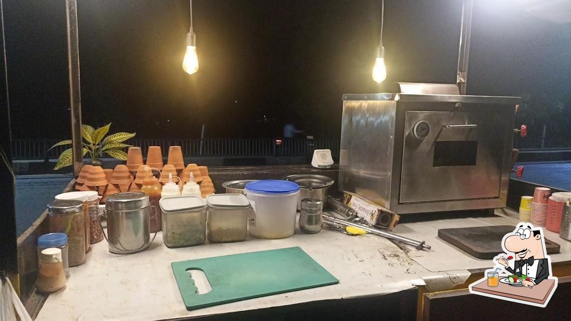 Famous kulhad Pizza Samaira HUTs. is distinguished by food and interior