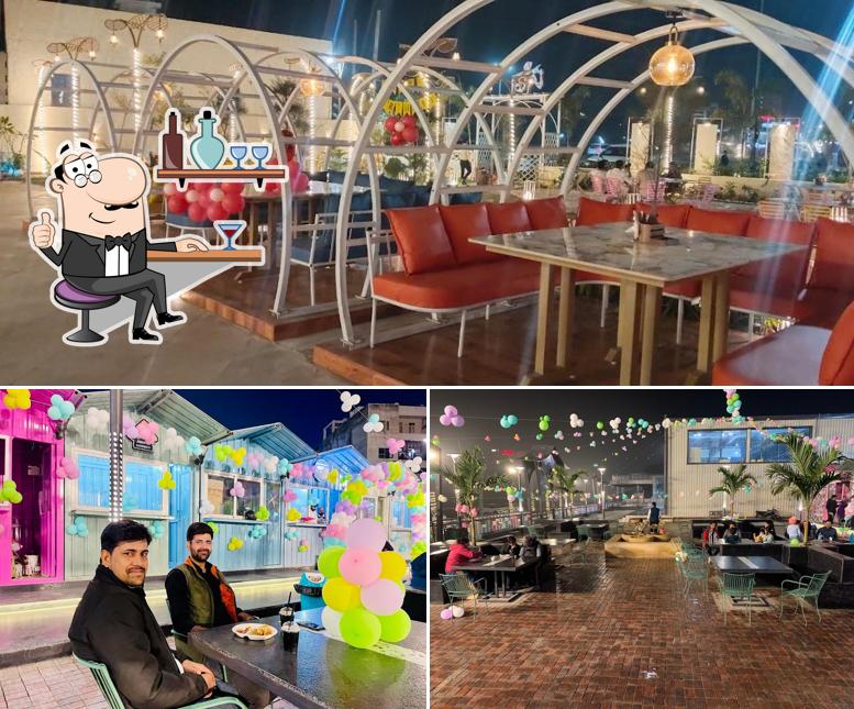 Take a seat at one of the tables at The Pankh Restaurant and Cafe & Banquet Hall - Mansarovar, Jaipur