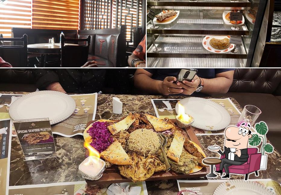 Take a seat at one of the tables at Bab Arabia