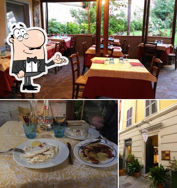 Dai un'occhiata agli interni di Taverna L'Inferno Sarzana