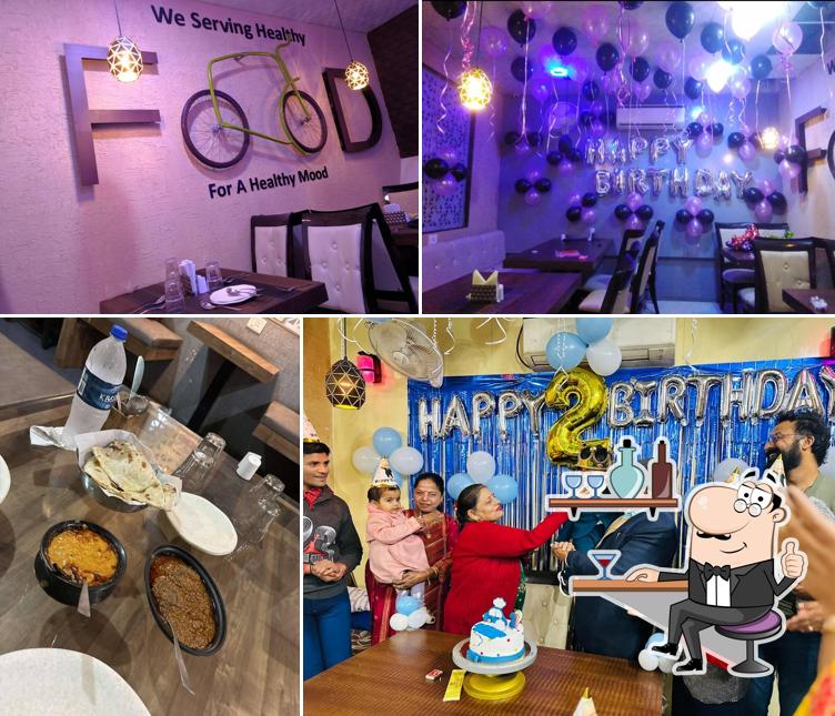 Take a seat at one of the tables at Nik's Restro & Cafe