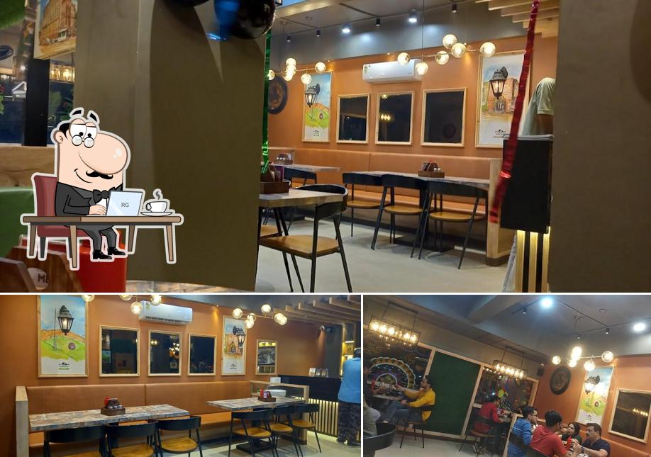 Take a seat at one of the tables at Thinking Cup Junagadh