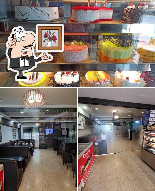 Among different things one can find interior and food at Dolphin Bakes ‘N’ Ice Creams