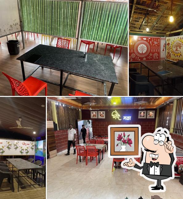 Take a seat at one of the tables at Hotel Shinde mala