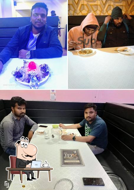 Take a seat at one of the tables at Janta Darbar