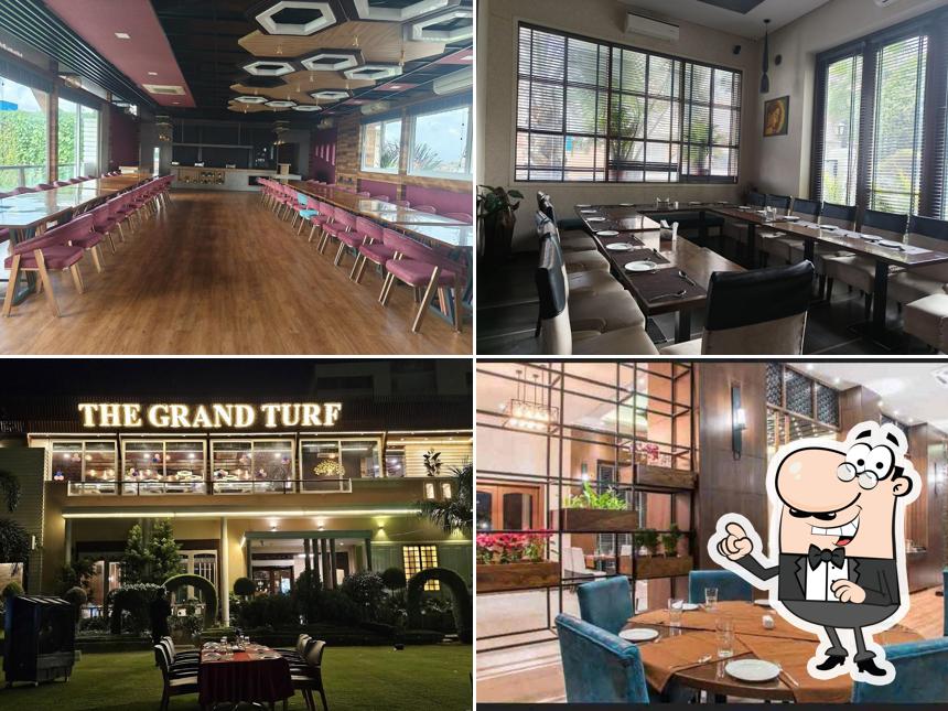 Take a seat at one of the tables at The Grand Turf Pure Vegetarian Family Restaurant