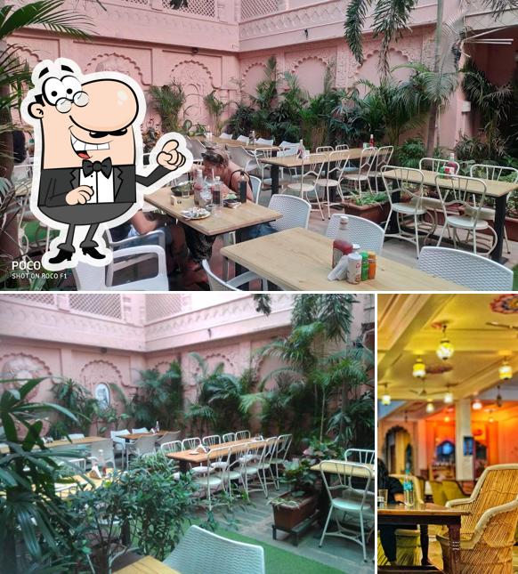 Take a seat at one of the tables at La Pizzaria Restaurant