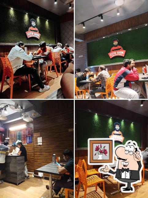 Take a seat at one of the tables at City Wok Fast Food Center